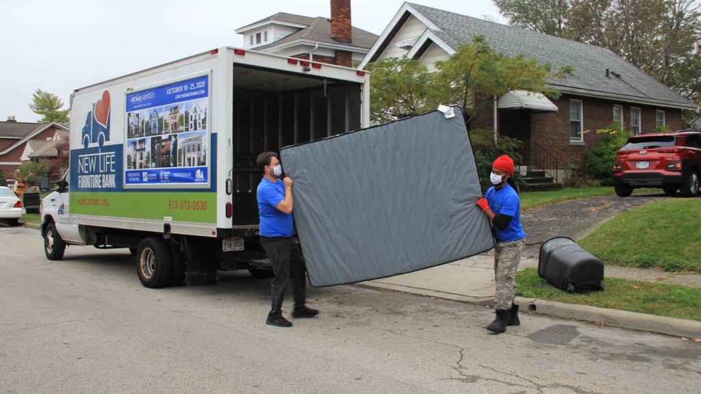 New Life Furniture Bank unloading donated furniture.
